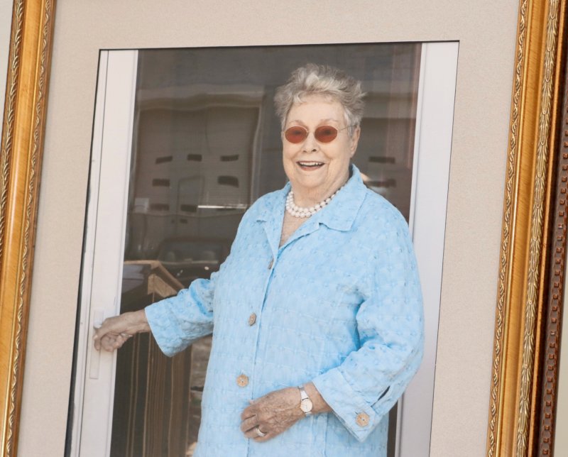 A photo of Jackie Finer greets guests April 4 in the lobby of Children’s Beach House in Lewes, where a celebration of life was held. Finer was the founder of Village Volunteers, an organization that provides essential support for older adults. She passed away in November at age 95. BILL SHULL PHOTOS